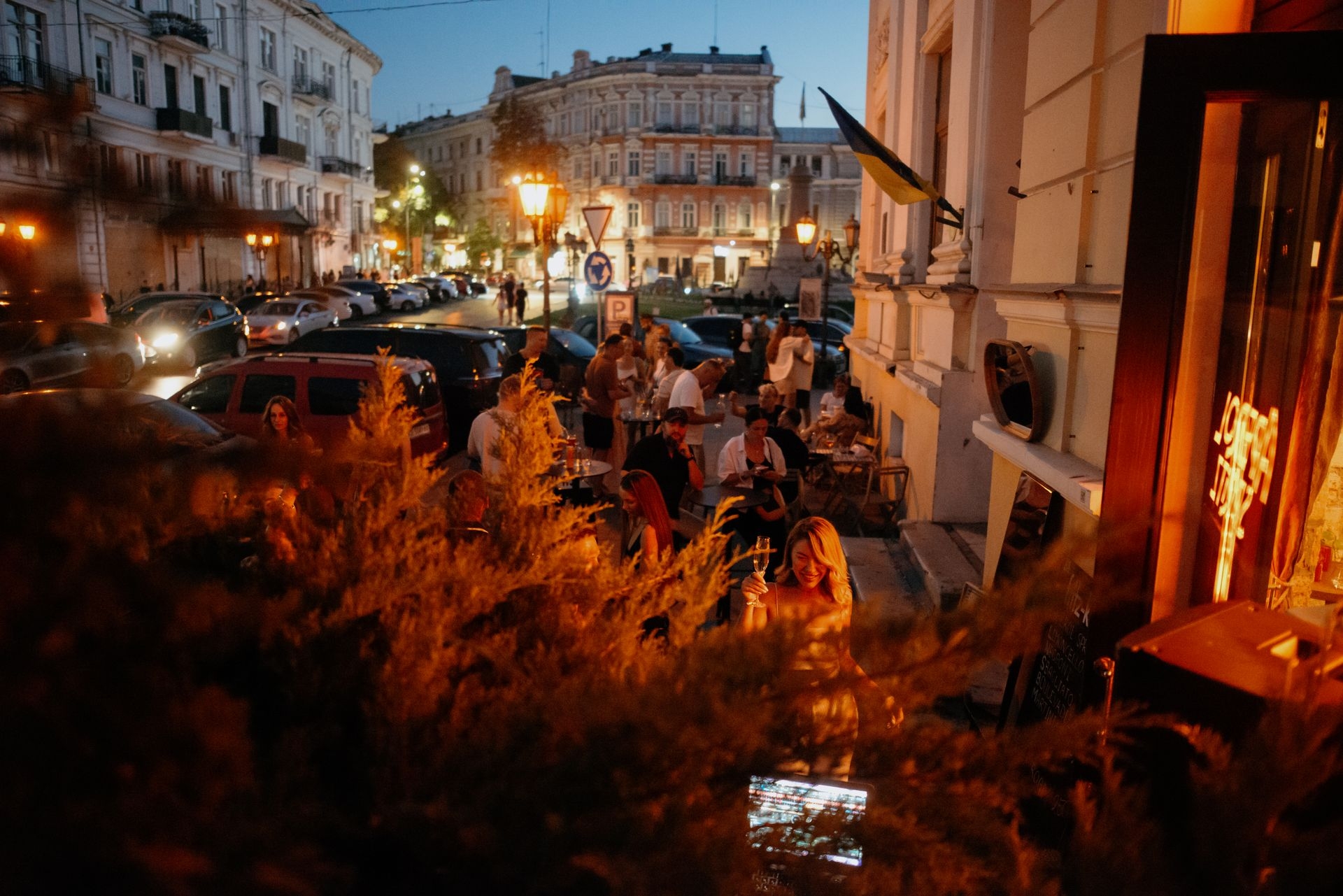 People hang out outside the bar in Odesa, Ukraine, on Aug. 8, 2025.