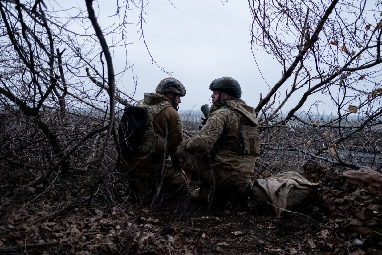Two Ukrainian mortarmen at a firing position near Pokrovsk, Donetsk Oblast, on Feb. 3, 2025. (Francis Farrell/The Kyiv Independent)
