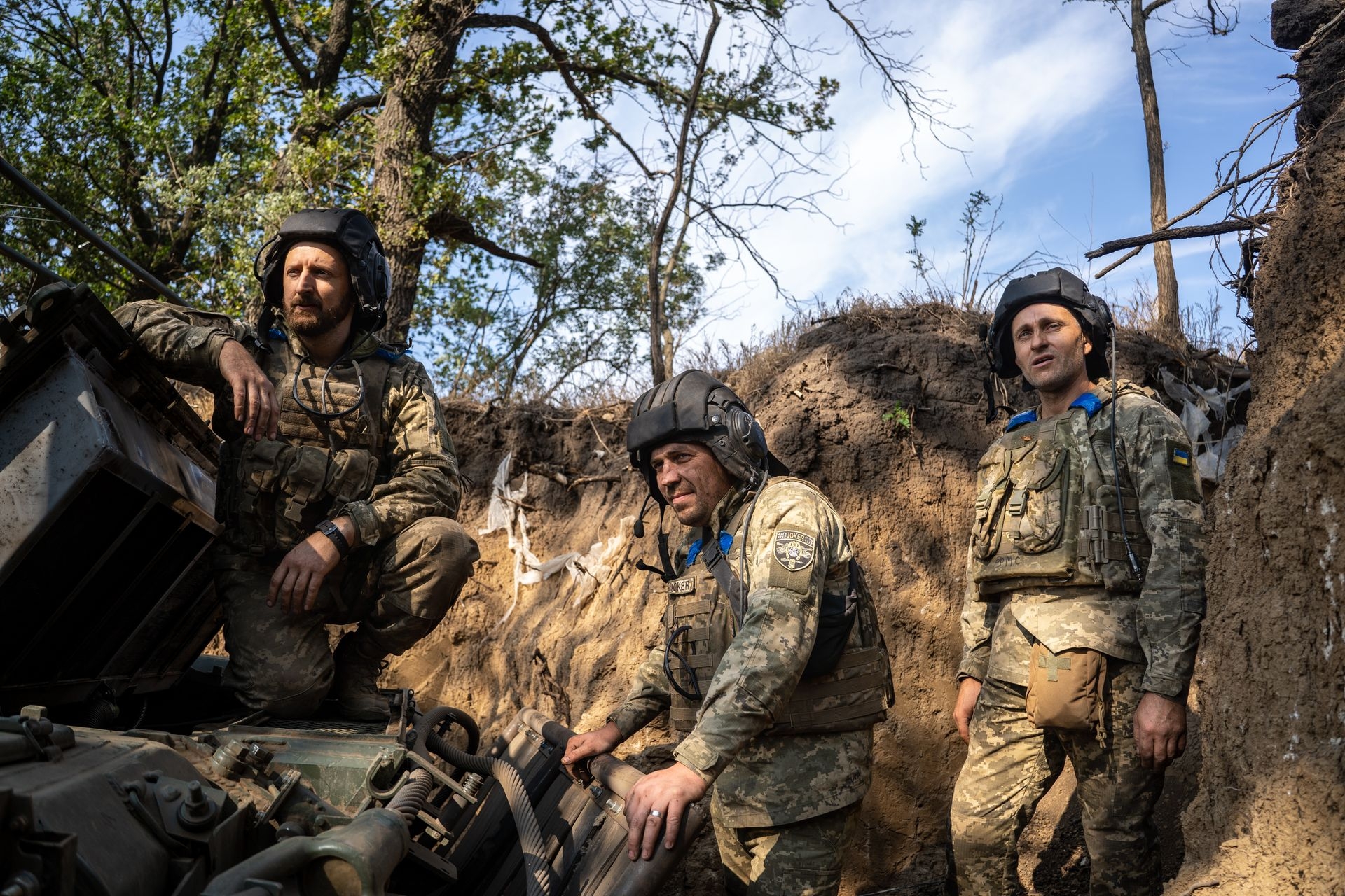 Ukrainian soldiers service tanks and armored vehicles in Kherson, Ukraine, on Aug. 8, 2025. 