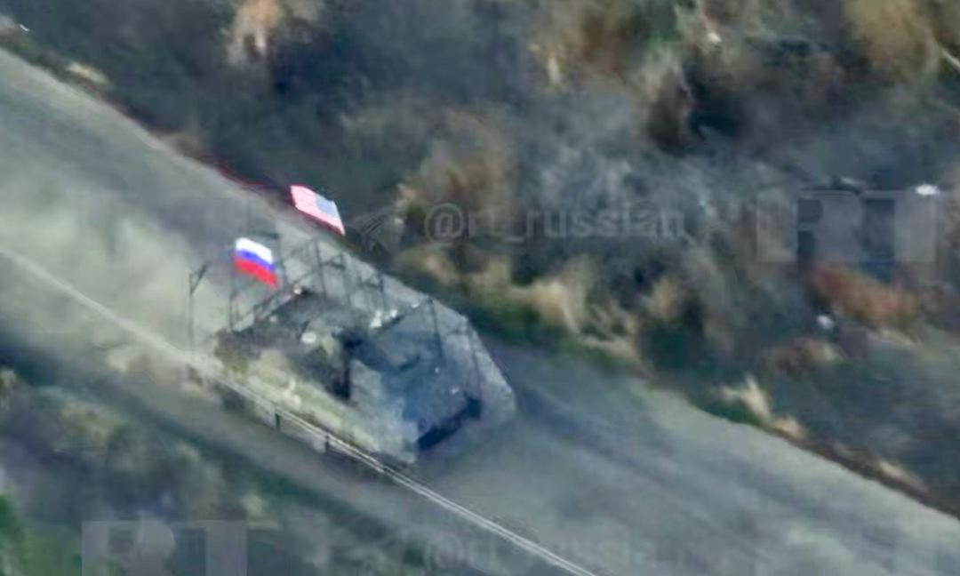 Russian media shows US armored vehicle with Russian, American flags storming Ukrainian positions (VIDEO)